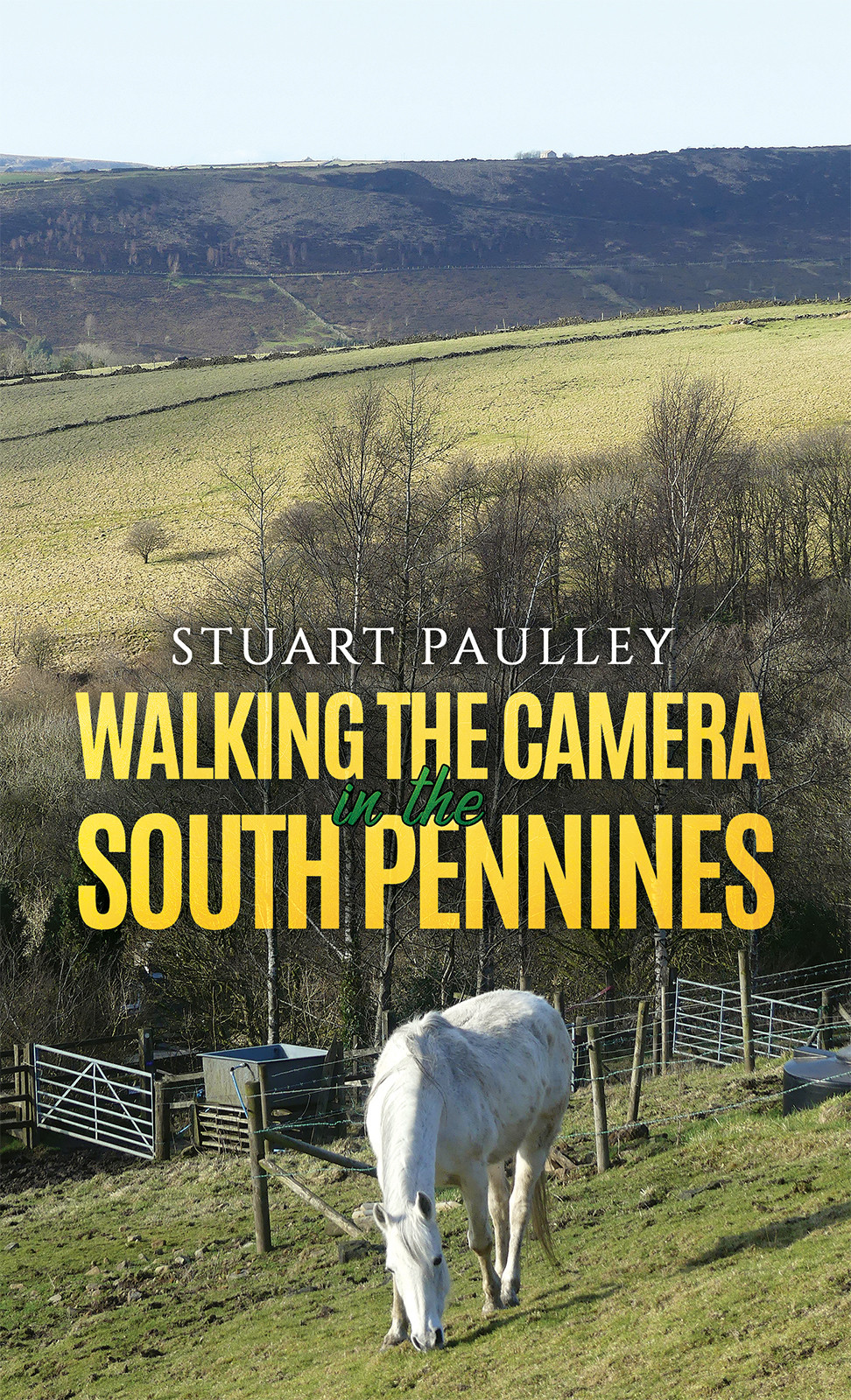 Title page of a book. A horse in a field, title Walking The Camera in the South Pennines by Stuart Paulley.